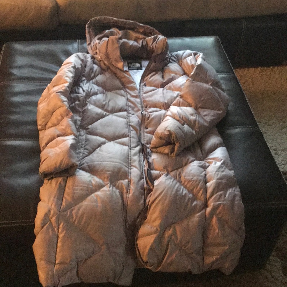 A light lavender long North Face Puff Coat